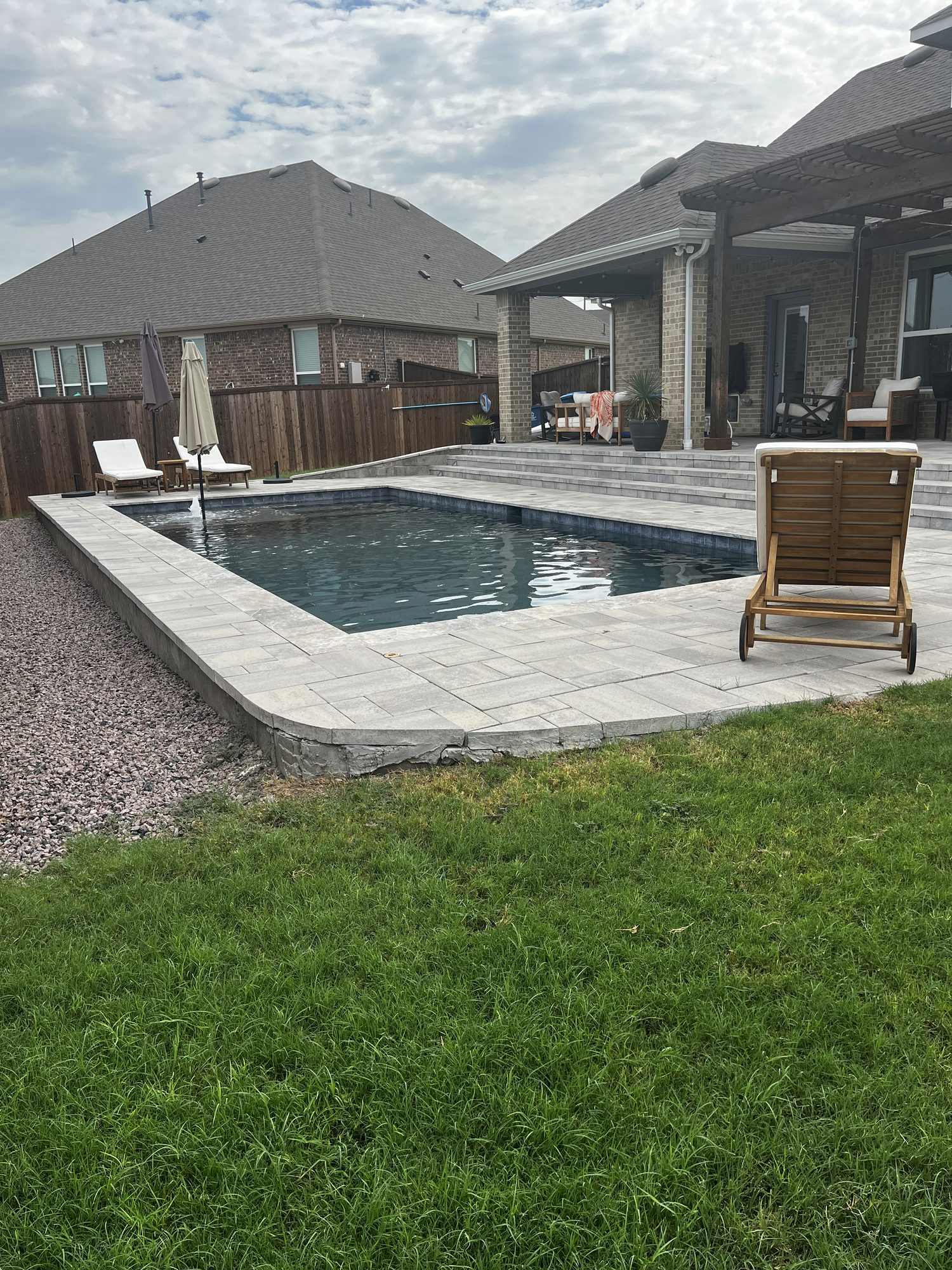 Pool and raised patio from the lawn